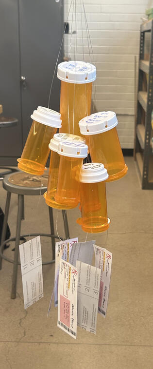 pill bottles with prescription as wind chimes